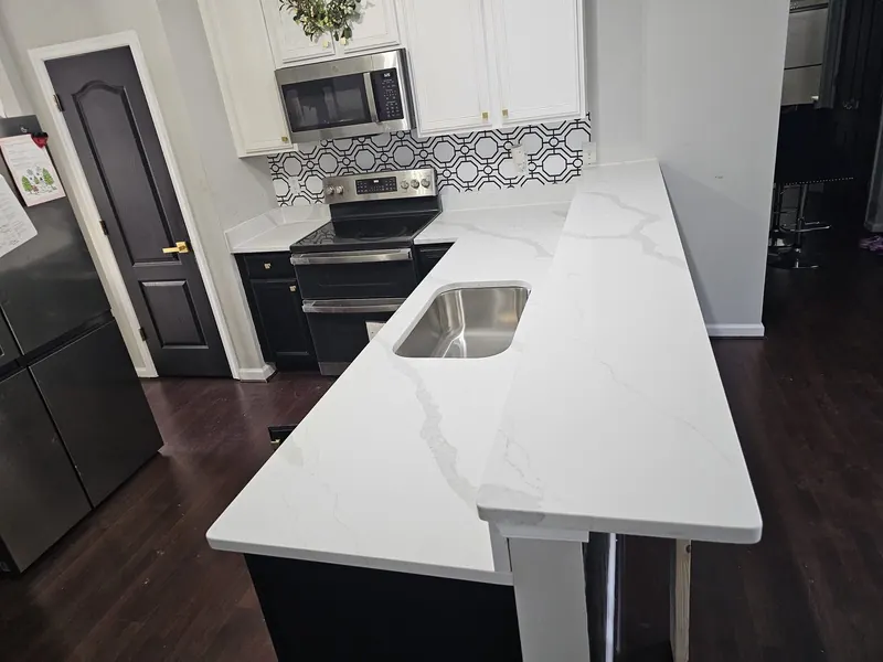 Calacatta-look L-shaped countertop with a raised bar – Beltway Countertops, Northern Virginia