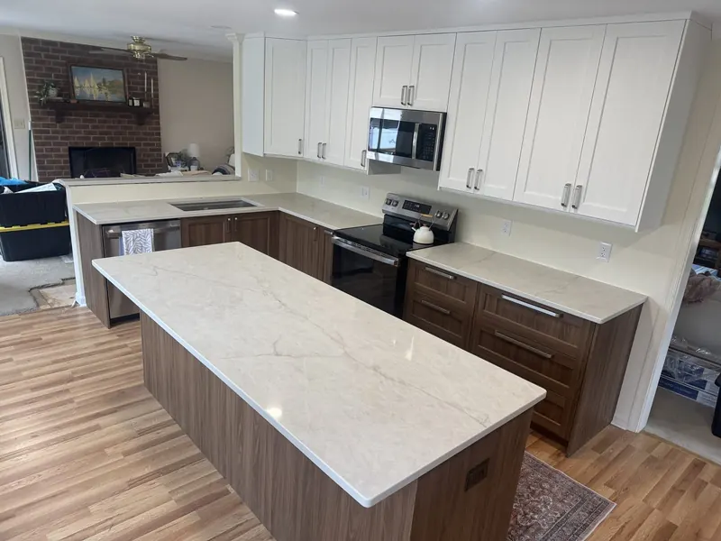 Cream quartz kitchen island with walnut cabinets – Beltway Countertops, Northern Virginia