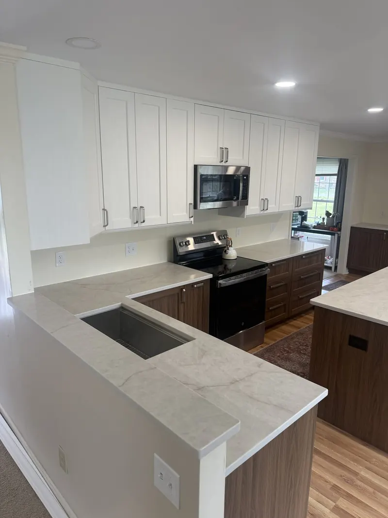 Cream quartz peninsula sink with walnut cabinets – Beltway Countertops, Northern Virginia