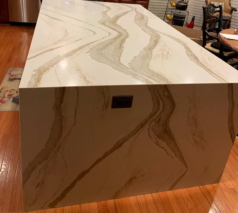 Gold-veined quartz waterfall island – installed by Beltway Countertops in Chantilly, VA