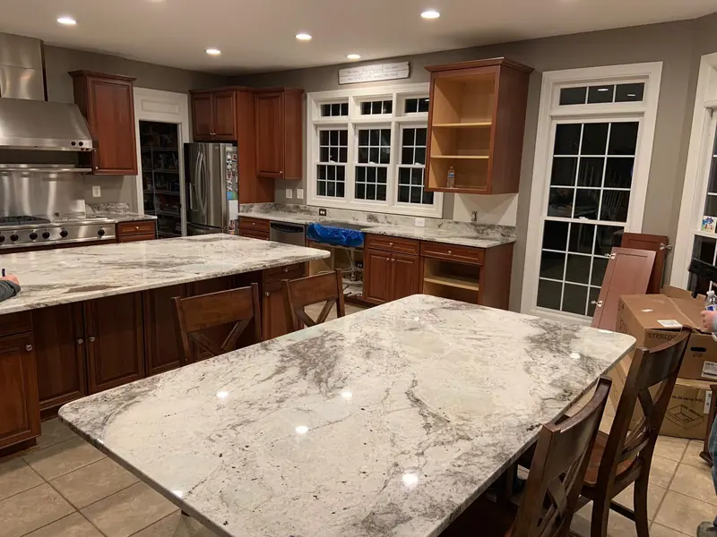 White and gray granite island and dining table top – installed by Beltway Countertops in Chantilly, VA
