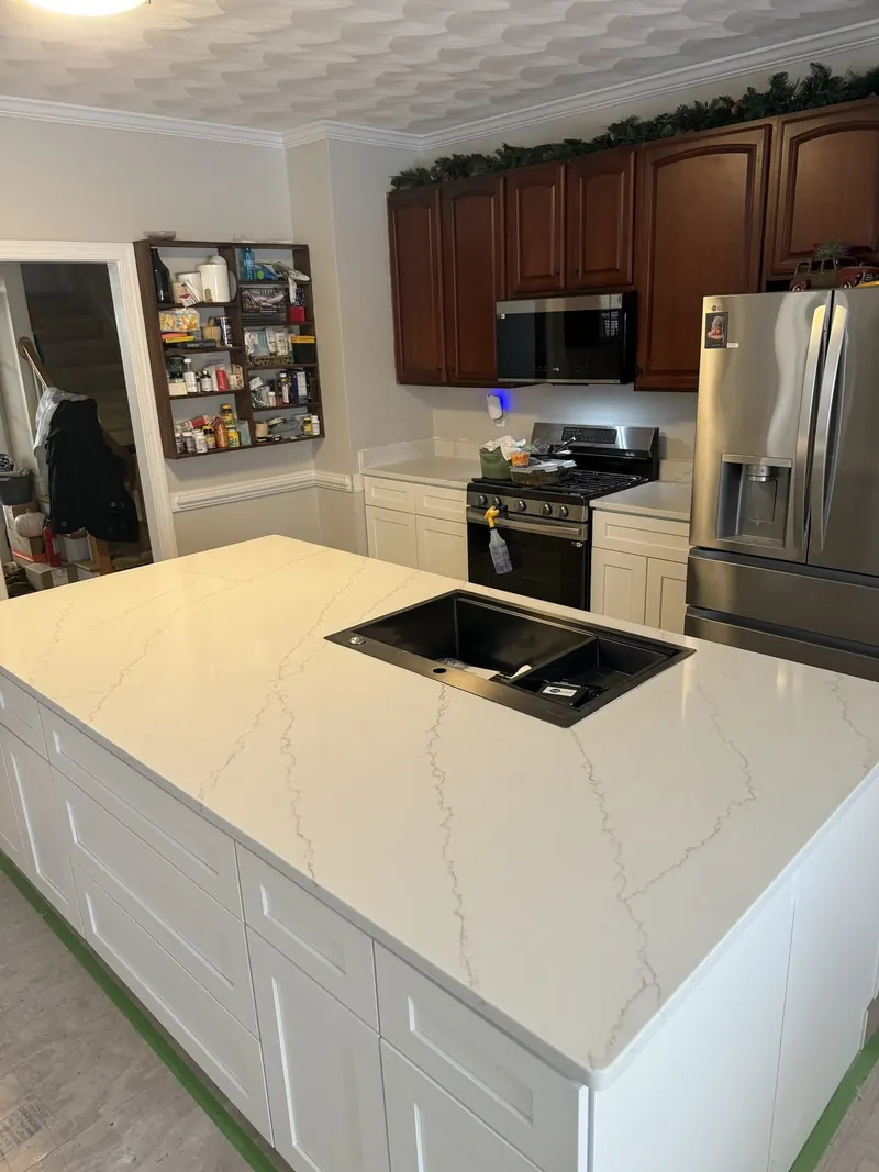White marble-look countertop on a kitchen island with a black sink – Beltway Countertops, Northern Virginia