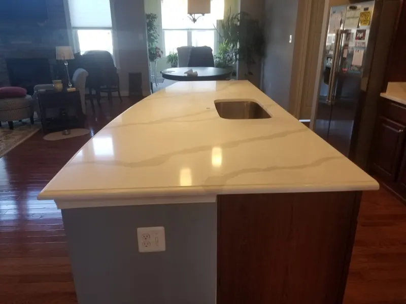 White quartz island with a soft rounded edge – installed by Beltway Countertops in Reston, VA